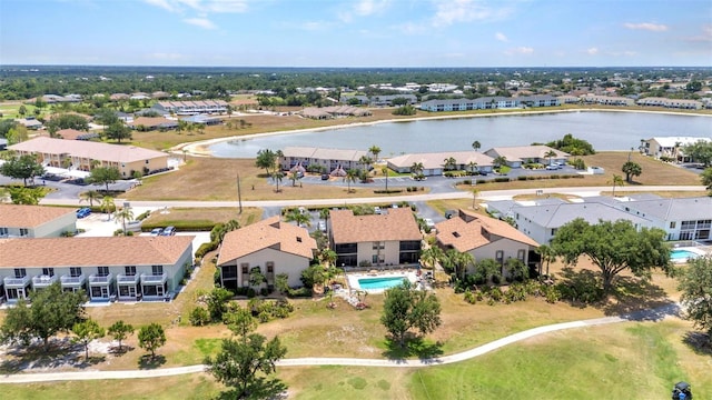 birds eye view of property featuring a water view and a residential view