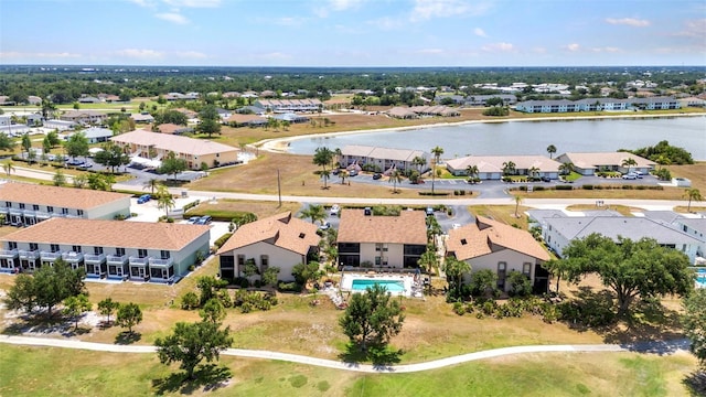 birds eye view of property with a residential view and a water view