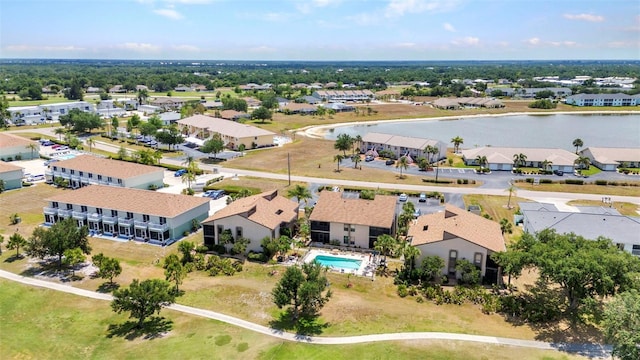 birds eye view of property with a water view and a residential view