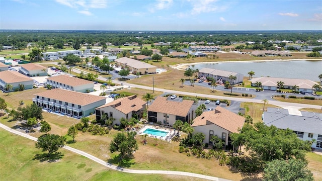 drone / aerial view featuring a water view and a residential view