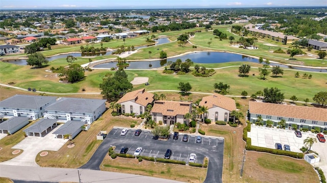 drone / aerial view featuring a water view and golf course view