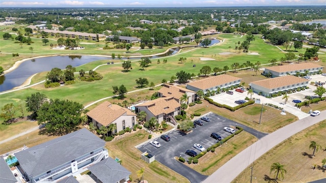 bird's eye view featuring a water view and golf course view