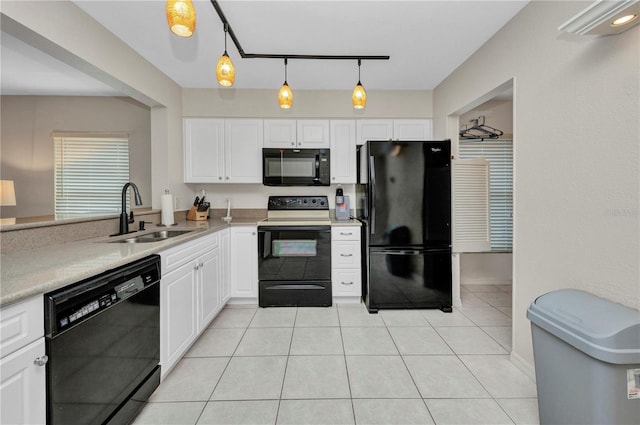 26336 Nadir Rd Unit 10, Punta Gorda, FL 33983 - kitchen with light countertops, white cabinetry, a sink, light tile patterned floors, and black appliances