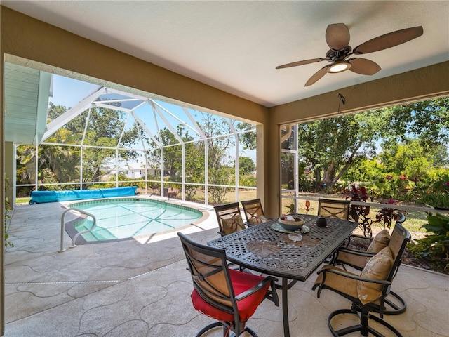 2288 Prague Ln, Punta Gorda, FL 33983 - view of pool with outdoor dining space, a covered pool, ceiling fan, a patio area, and glass enclosure