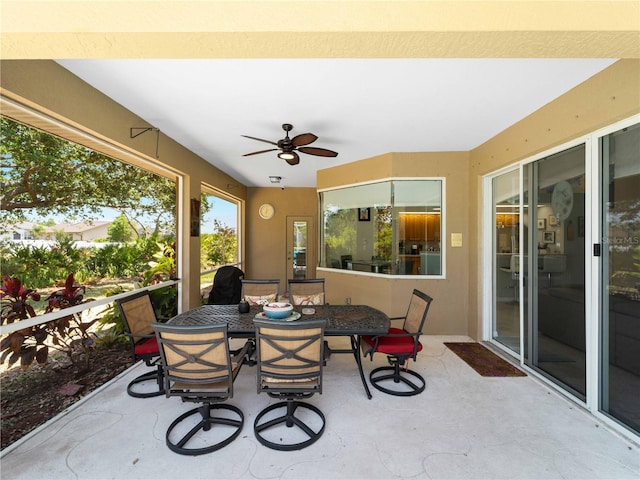 2288 Prague Ln, Punta Gorda, FL 33983 - sunroom featuring a ceiling fan and outdoor dining area