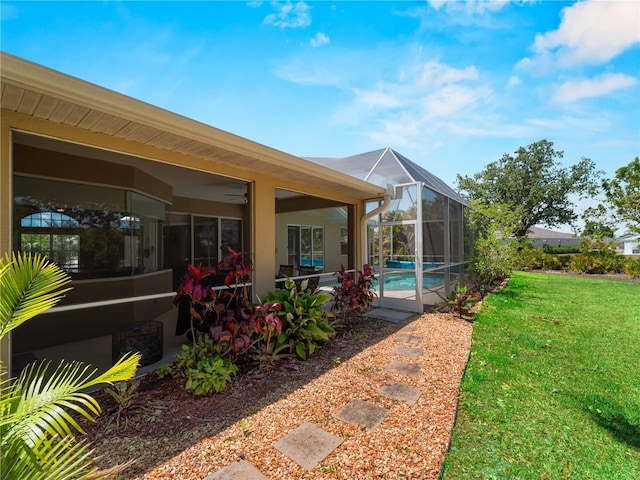 2288 Prague Ln, Punta Gorda, FL 33983 - back of house featuring a patio, stucco siding, an outdoor pool, a lanai, and a yard