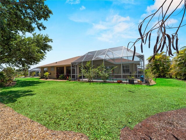 2288 Prague Ln, Punta Gorda, FL 33983 - back of house featuring a yard and a lanai