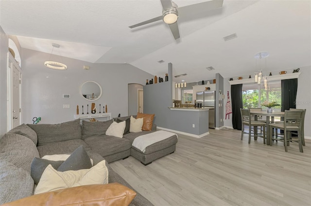 4129 Palisades Ave, North Port, FL 34287 - living room with visible vents, a ceiling fan, baseboards, light wood-type flooring, and vaulted ceiling