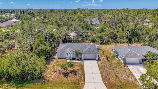 4129 Palisades Ave, North Port, FL 34287 - birds eye view of property featuring a wooded view