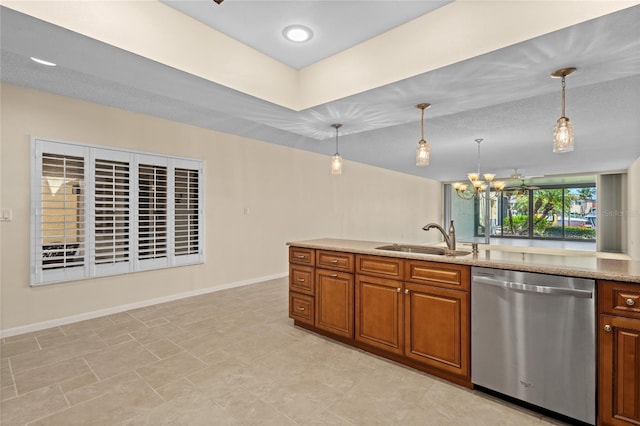 3230 Southshore Dr Unit 33A, Punta Gorda, FL 33955 - kitchen featuring dishwasher, a sink, brown cabinetry, a chandelier, and baseboards