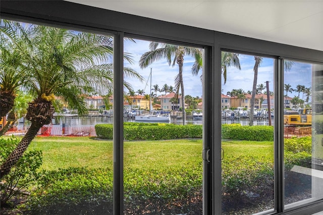 3230 Southshore Dr Unit 33A, Punta Gorda, FL 33955 - doorway with a water view, plenty of natural light, and a residential view