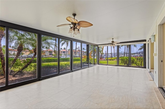 3230 Southshore Dr Unit 33A, Punta Gorda, FL 33955 - unfurnished sunroom featuring a ceiling fan and tile patterned flooring