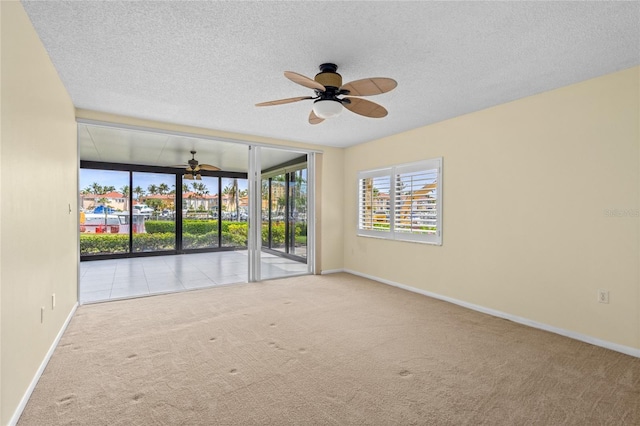 3230 Southshore Dr Unit 33A, Punta Gorda, FL 33955 - carpeted spare room featuring a ceiling fan, baseboards, and a textured ceiling