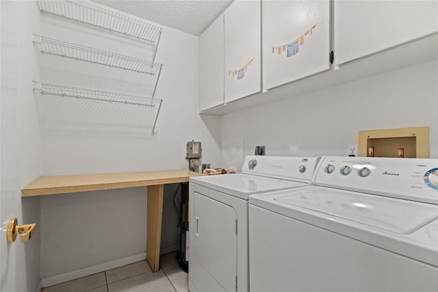 3230 Southshore Dr Unit 33A, Punta Gorda, FL 33955 - washroom featuring cabinet space, washing machine and clothes dryer, light tile patterned flooring, baseboards, and an office area