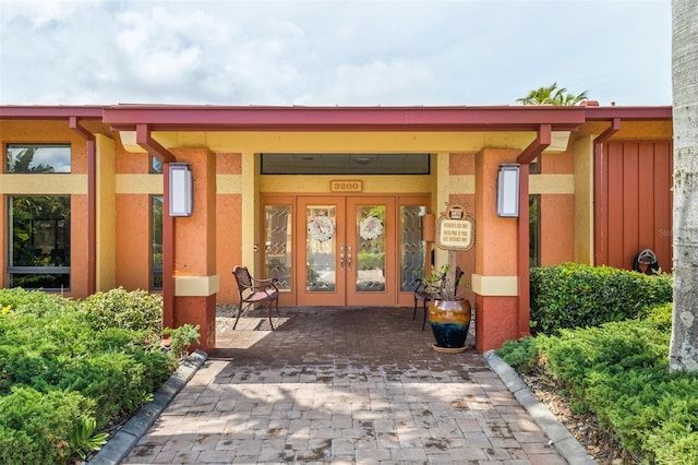 3230 Southshore Dr Unit 33A, Punta Gorda, FL 33955 - doorway to property featuring french doors and stucco siding