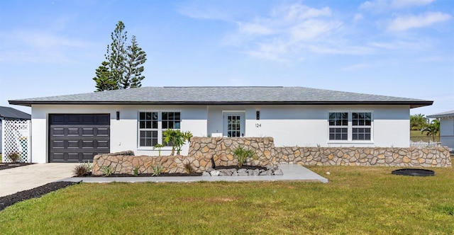 124 Rotonda Cir, Rotonda West, FL 33947 - view of front of house with stucco siding, driveway, roof with shingles, a front yard, and an attached garage