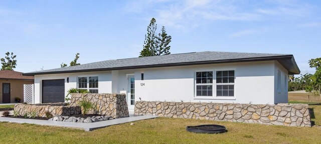 124 Rotonda Cir, Rotonda West, FL 33947 - exterior space featuring roof with shingles, stucco siding, a yard, and an attached garage