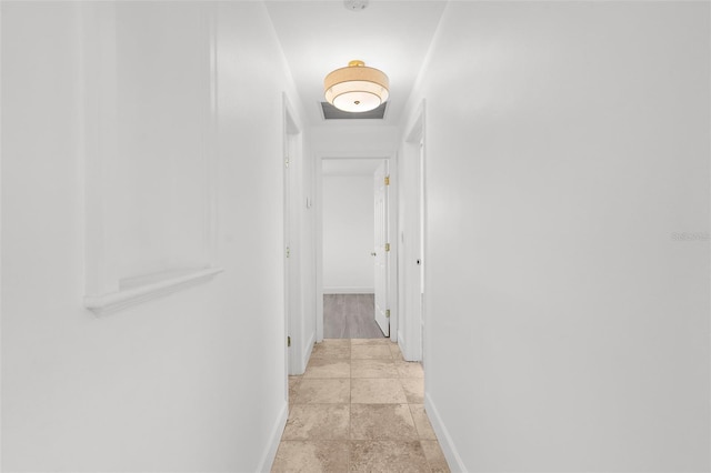 124 Rotonda Cir, Rotonda West, FL 33947 - corridor with baseboards and stone finish floor