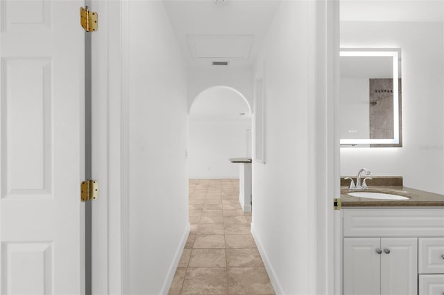 124 Rotonda Cir, Rotonda West, FL 33947 - hallway with visible vents, baseboards, and a sink