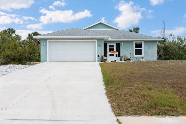 single story home with a shingled roof, an attached garage, a front lawn, stucco siding, and concrete driveway