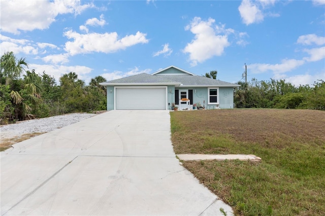 single story home featuring an attached garage, stucco siding, driveway, and a front lawn