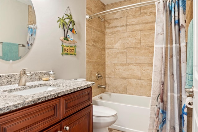 bathroom with toilet, shower / bath combination with curtain, and vanity