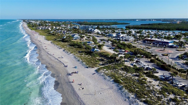 drone / aerial view with a view of the beach and a water view