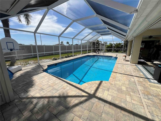 view of pool with a lanai, a fenced backyard, a fenced in pool, and a patio area