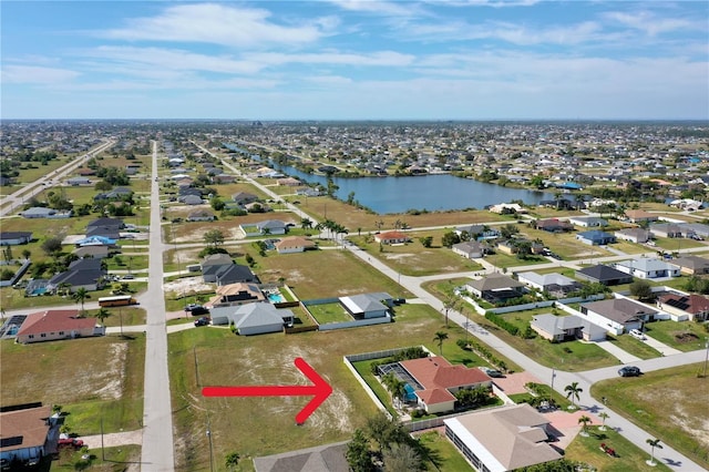 aerial view with a residential view and a water view