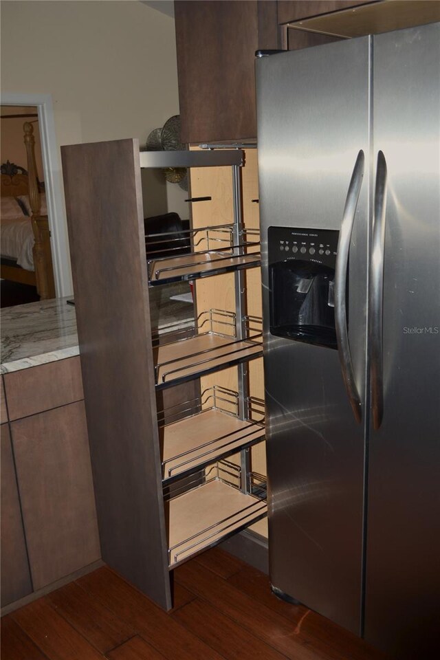 1118 NW 17th St, Cape Coral, FL 33993 - kitchen with stainless steel fridge with ice dispenser, modern cabinets, and dark wood finished floors