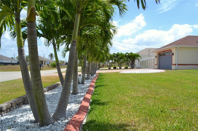 1118 NW 17th St, Cape Coral, FL 33993 - view of yard with a garage