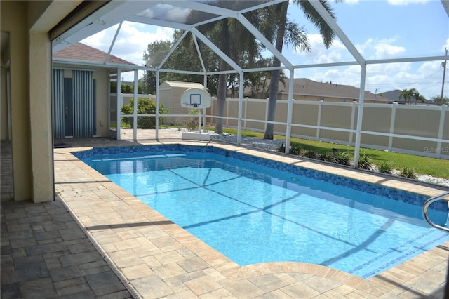 1118 NW 17th St, Cape Coral, FL 33993 - view of pool featuring glass enclosure, a fenced in pool, a shed, and a fenced backyard