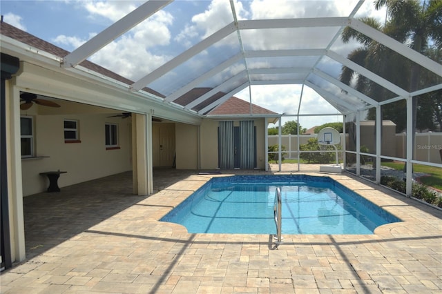 1118 NW 17th St, Cape Coral, FL 33993 - pool featuring ceiling fan, an outbuilding, a patio area, glass enclosure, and a shed