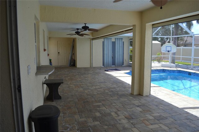 1118 NW 17th St, Cape Coral, FL 33993 - outdoor pool with a ceiling fan, a patio area, and a lanai