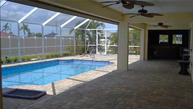 1118 NW 17th St, Cape Coral, FL 33993 - outdoor pool with a patio, ceiling fan, and glass enclosure