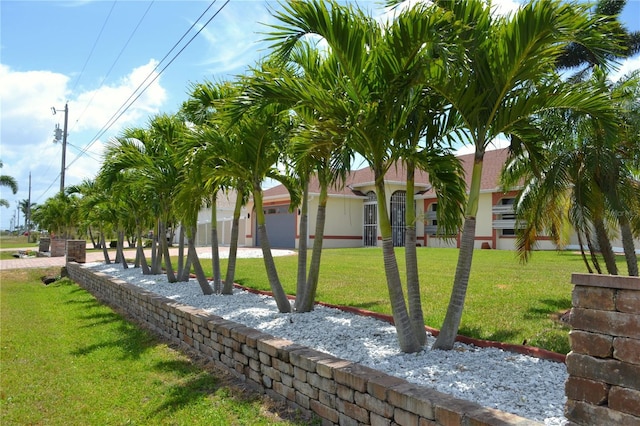 1118 NW 17th St, Cape Coral, FL 33993 - surrounding community featuring a lawn