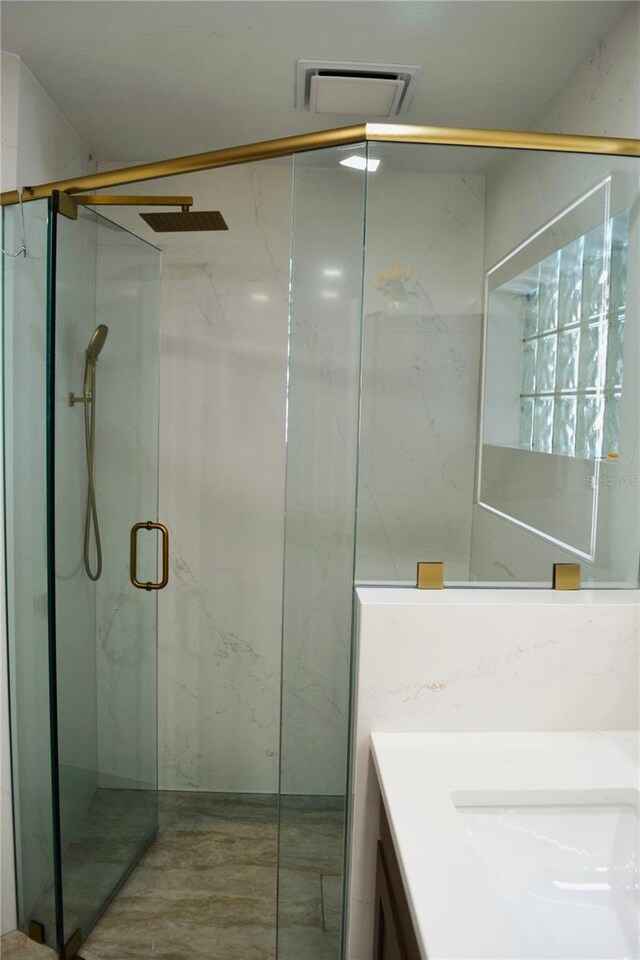 1118 NW 17th St, Cape Coral, FL 33993 - bathroom featuring visible vents, a marble finish shower, and vanity
