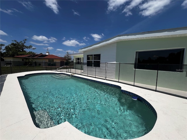 view of swimming pool with a fenced in pool, a patio area, and fence