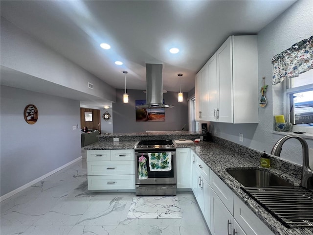kitchen with stainless steel range with electric stovetop, a peninsula, island range hood, white cabinets, and a sink