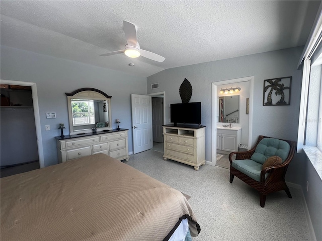 bedroom featuring visible vents, baseboards, a textured ceiling, connected bathroom, and a ceiling fan