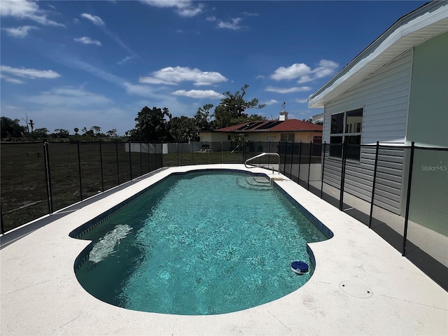 view of swimming pool featuring a fenced backyard and a fenced in pool