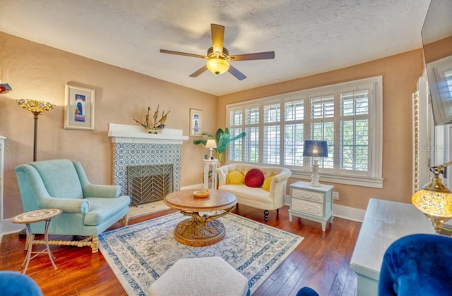 2002 Central Ave, Sarasota, FL 34234 - living area featuring a ceiling fan, wood-type flooring, and a fireplace