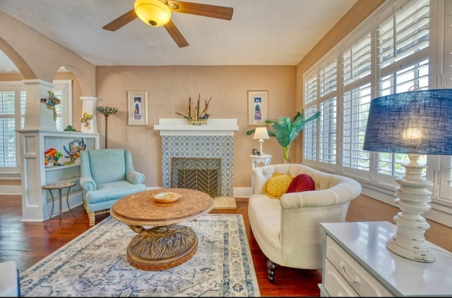 2002 Central Ave, Sarasota, FL 34234 - living room with healthy amount of natural light, wood finished floors, ceiling fan, and arched walkways