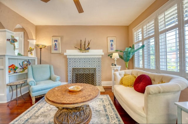 2002 Central Ave, Sarasota, FL 34234 - living room with a ceiling fan, wood finished floors, and a tile fireplace