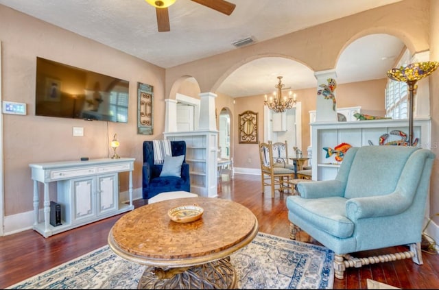 2002 Central Ave, Sarasota, FL 34234 - living room with arched walkways, wood finished floors, a chandelier, and ceiling fan