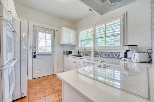 2002 Central Ave, Sarasota, FL 34234 - kitchen featuring plenty of natural light and light countertops
