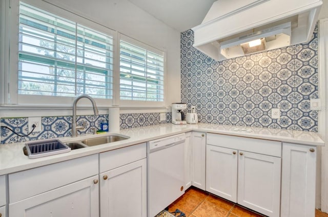 2002 Central Ave, Sarasota, FL 34234 - kitchen with white dishwasher, custom exhaust hood, decorative backsplash, and light countertops