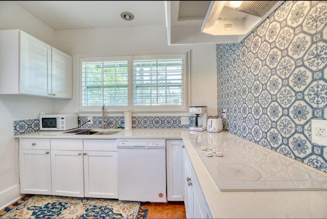 2002 Central Ave, Sarasota, FL 34234 - kitchen featuring white appliances, light countertops, and white cabinets