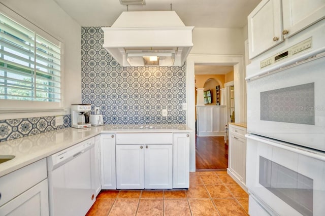2002 Central Ave, Sarasota, FL 34234 - kitchen with white appliances, custom exhaust hood, tasteful backsplash, and light countertops