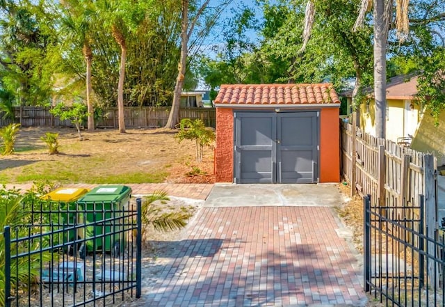 2002 Central Ave, Sarasota, FL 34234 - fenced backyard featuring a storage shed and a patio area